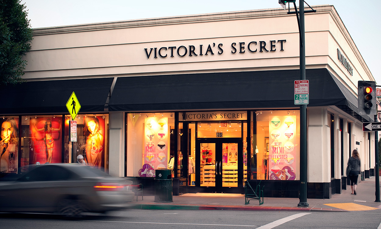 Victoria's Secret storefront with pedestrian on sidewalk